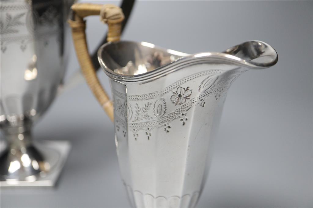 An Edwardian engraved silver three piece pedestal coffee set by James Deakin & Sons, Sheffield, 1904,